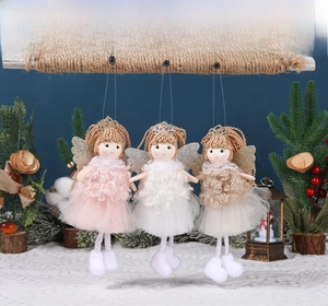 Three plush Christmas angel dolls with ponytails hanging from a rustic wooden bar