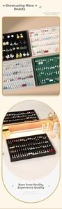 Detailed view of velvet jewelry display trays for earrings in four elegant colors