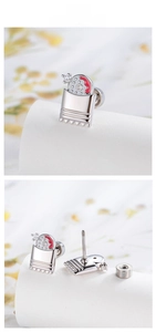 Detail showing cartoon character stud earrings with red enamel and secure screw back