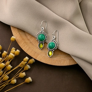 Bohemian vintage earrings with turquoise stone and teardrop gem on wood and silk