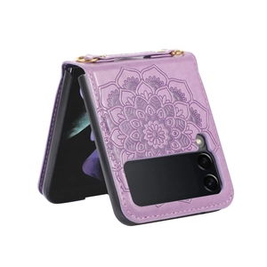 Detail of purple leather foldable case with mandala pattern and gold metal ring strap