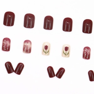Short square press-on nails with red tulip art and glitter gradient in 24-piece set