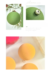 Close-up of 6cm macaron flocked Christmas balls with soft velvet texture and metal loops