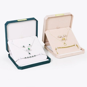 Octagonal velvet jewelry gift set boxes with necklace, earrings, and ring in emerald and pearl