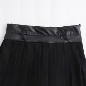 Women black pleated mini skirt with stylish faux leather waist belt detail and clean look