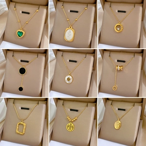 Collection of geometric gold-plated stainless steel necklaces with various artistic pendants
