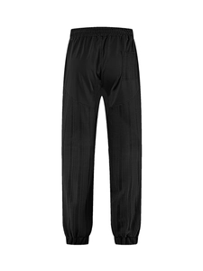 Detail view of black linen-texture sweatpants featuring an elastic waist and back pocket