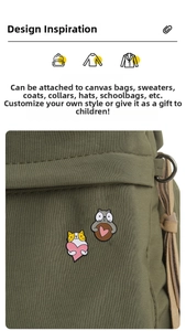 Pair of cute enamel cat pins with pink hearts shown on a green canvas bag strap