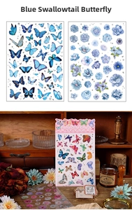 Macro detail of blue butterfly and floral scrapbook stickers for creative DIY journaling