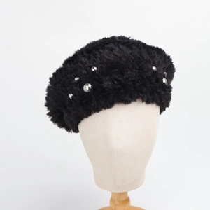 Detailed shot of black faux fur beret featuring elegant silver beaded accents