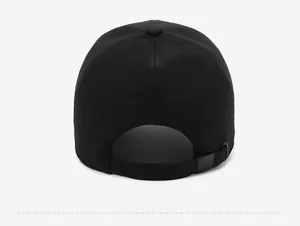 Detail view of the black baseball cap back with adjustable metal buckle and strap