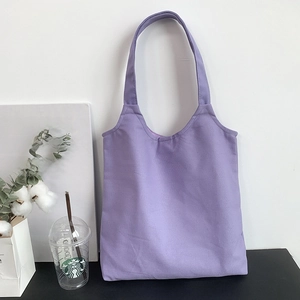 Detail of purple canvas tote bag texture with minimalist plain cotton material design