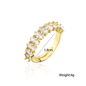 Detailed view of an adjustable 18K gold plated ring with oval cubic zirconia stones