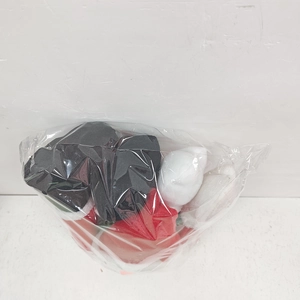 Christmas plush tree topper ornaments packaged in a transparent plastic storage bag