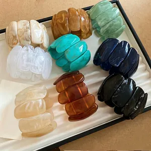 Rectangle acrylic marble print bracelets in diverse colors displayed on a white tray