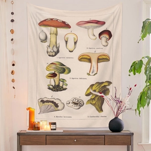 Macro detail of vintage mushroom illustrations on a bohemian cream wall tapestry decoration