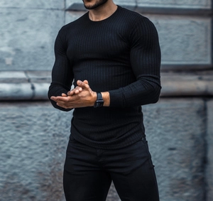 Close-up of black slim-fit ribbed long sleeve t-shirt showing detailed knit texture