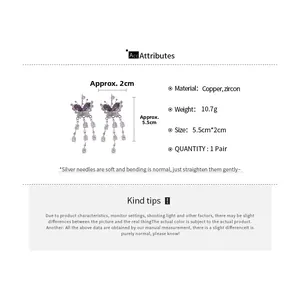 Detail view of butterfly drop earrings with purple stones and zircon tassels specifications