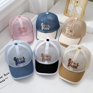 Detail of mesh baseball caps for kids with breathable panels and bear embroidery