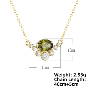 Detailed view of oval green zircon pendant necklace with white crystal cluster details