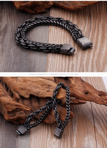 Detailed close-up of retro braided stainless steel bracelet on a rustic wood background