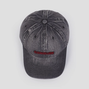 Top view of washed charcoal baseball cap featuring red CONQUER 3D embroidery detail