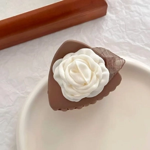 Brown hair claw clip with white fabric camellia flower and mesh leaf decoration