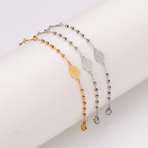 Minimalist stainless steel beaded bracelet with praying hands charm in gold and silver
