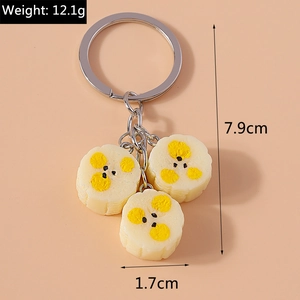 Detail shot of cute resin banana keychain with size dimensions of 7.9cm and 12.1g weight