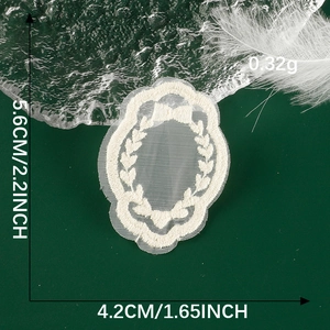 Detailed cream lace bow embroidery patch dimensions 5.6x4.2cm on a dark background