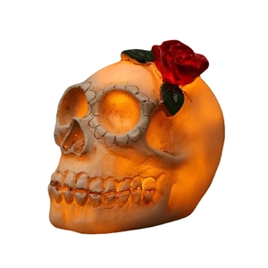 Halloween skull LED lamp with red rose decoration on top and warm orange light glow