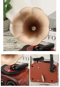 Detailed views of vintage gramophone music box featuring brass horn and wind-up mechanism