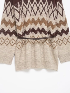 Detail of vintage jacquard knit cardigan with argyle patterns and slim brown waist belt