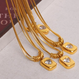 Vintage gold layered snake chain necklace with heart pendant and cubic zirconia