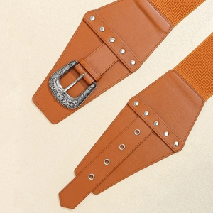 Detail of vintage brown wide belt with engraved silver buckle and elastic band texture