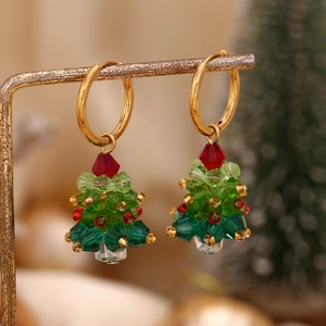 Macro shot of 18K gold plated Christmas tree earrings with colorful faceted beads
