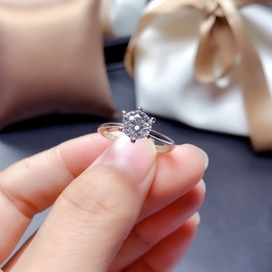 Close-up of a 1-carat brilliant cut diamond ring with classic six-prong setting