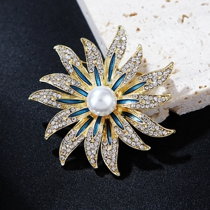 Elegant sunflower brooch with white crystals, blue enamel and a large pearl center