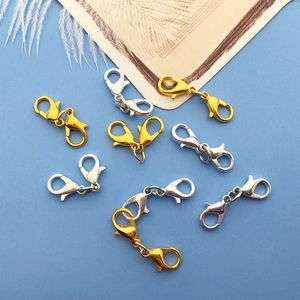 Macro shot of gold and silver zinc alloy double lobster clasps for DIY jewelry making