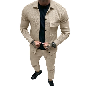 Detailed texture of men's twill jacket and trousers set in beige vertical stripe fabric