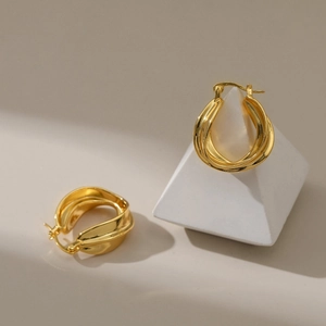 Irregular 18K gold plated hoop earrings with layered geometric texture and glossy finish
