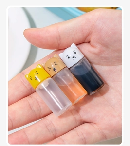 Mini portable squeeze condiment bottles with cute cartoon animal lids for bento lunches