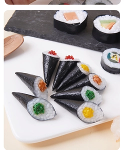 Detailed realistic artificial sushi model set with rolls and nigiri on a plate