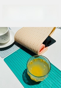 Detailed view of striped silicone draining mat for non-slip and heat resistant usage