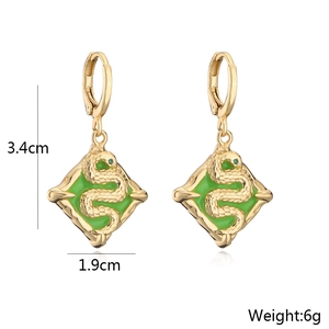 Detail view of 18K gold plated square snake earrings with green enamel and measurements
