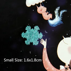 Teal translucent resin snowflake with silver glitter detail, small size 1.6x1.8cm