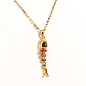 Detail of creative fish bone pendant necklace with colorful zircons and golden chain