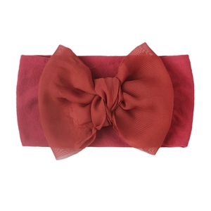 Detail of burgundy baby turban headband with large chiffon double layer bow design