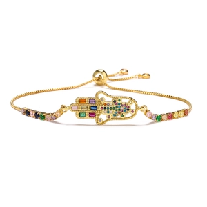 Detail of 18K gold plated Hamsa Hand bracelet featuring colorful zircon and slide closure