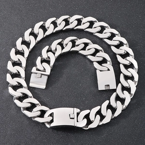 Polished silver cuban link chain set with a secure rectangular clasp on dark background